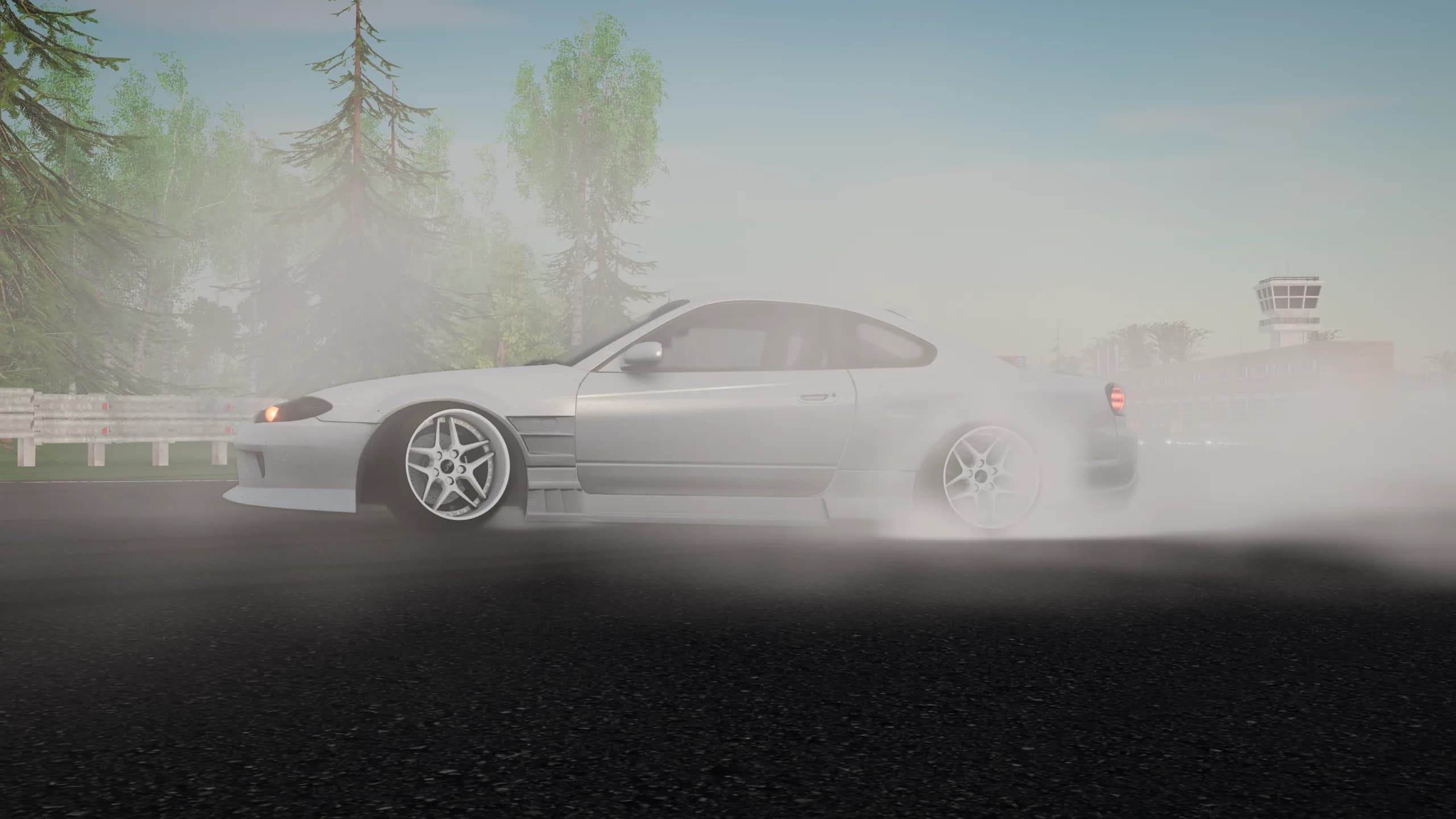 S15 drifting sideways through tyre smoke